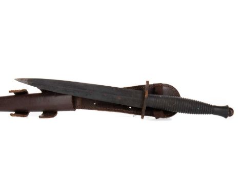 FAIRBAIRN SYKES-TYPE FIGHTING KNIFE, WWII-PERIOD stamped with military broad arrow over numeral 12, in original leather scabb