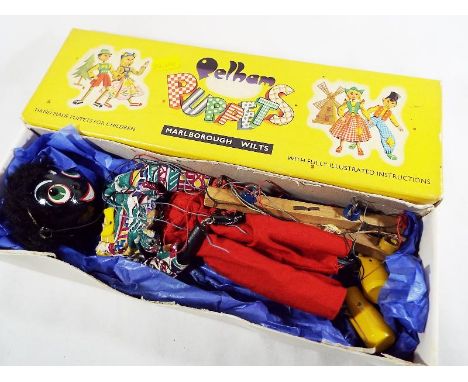 A Pelham Puppet in the form of a Golliwog, good+ in good+ original box - Est £40 - £60