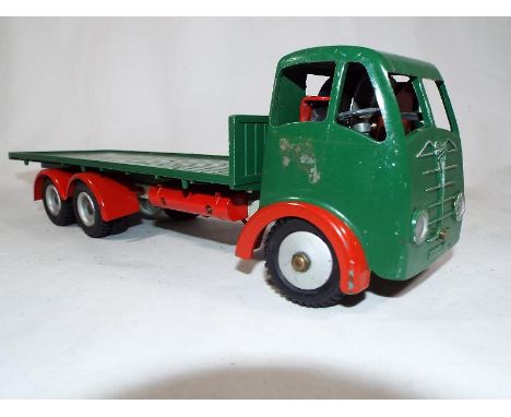 A Shackleton Foden FG6 Platform type flatbed lorry, clockwork 6-wheeled model with green cab and flatbed, grey chassis and re