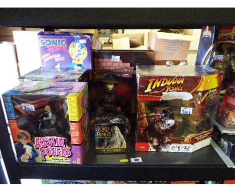 A collection of boxed figures to include Sonic the Hedgehog, Pirates of the Caribbean, Austin Powers, Lord of the Rings, Indi