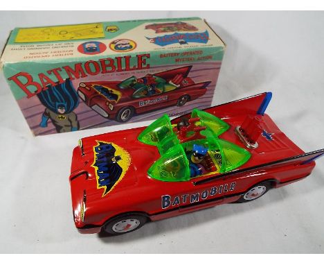 Batman - a battery operated tin plate Batmobile, red tin plate, blinking warning light and jet engine noise # 2001, Taiwan, n