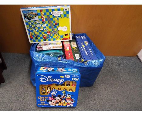 A Disney chess set, boxed, The Simpsons 3D chess set, boxed, and a collection of jigsaws 