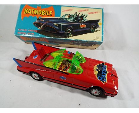 Batmobile - a tin plate Batmobile by ASC # 1-175, battery powered, mystery action, jet engine noise, blinking warning lights,