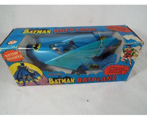Batman - a battery operated official Batman Batplane, made in Hong Kong plane with Blinking Lights, Jet Engine Sound, Automat