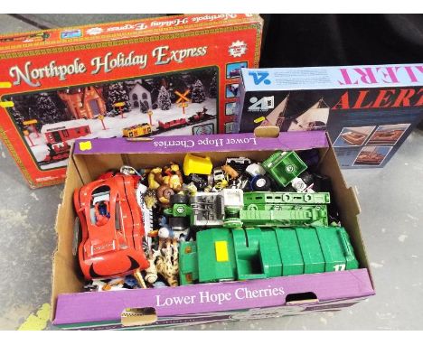 A collection of model farmyard animals, model motor vehicles, a North Pole Holiday Express train set, boxed and a Artesania L