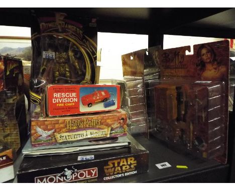 A mixed lot of sealed blister packs and figures to include Power Rangers, Evil Space Aliens, Buffy the Vampire Slayer, The X 