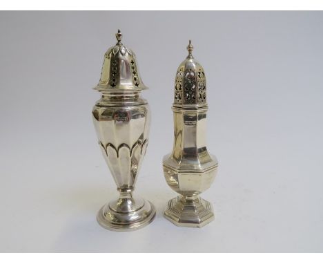 Two silver sugar castors with finial tops, marks rubbed, 16cm and 15cm tall, 139g 