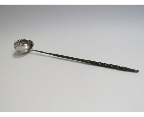 A Georgian silver toddy ladle with twisted baleen handle, marks indistinct 