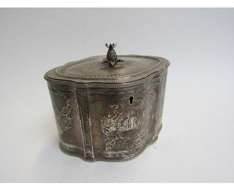 A Daniel Smith &amp; Robert Sharp silver tea caddy of shaped serpentine form, the lid surmounted by a pineapple, the body eng