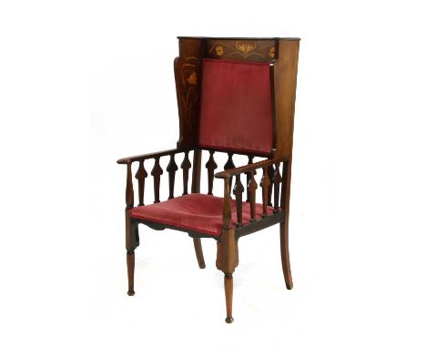 A mahogany inlaid wingback armchair,inlaid with scrolling flowers, upholstered back and seat, with arrow-shaped splats, 63cm 