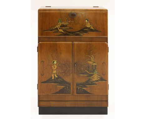 An Art Deco walnut and chinoiserie-decorated cabinet,with a printed and mirrored interior, with cocktail sticks and squeezer,