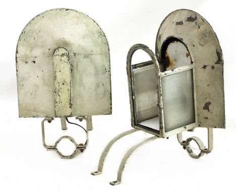 A pair of Art Deco architectural wall lights,each with a coated rounded top over panels, some missing, with a wrought iron po