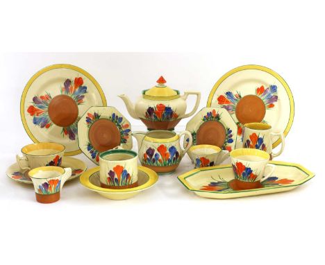 A large quantity of Clarice Cliff 'Crocus' items, to include an Athens shape teapot, a Windsor jug,a flower frog, a sandwich 