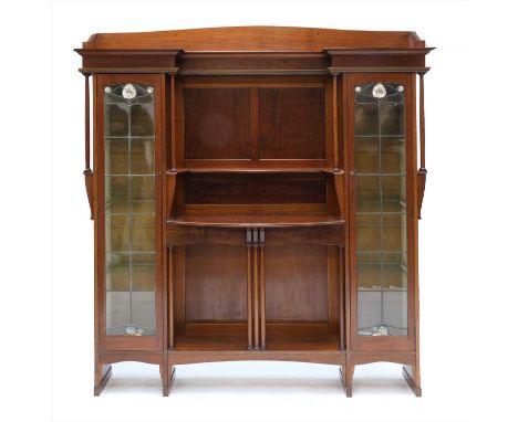 A Liberty mahogany display cabinet,of breakfront form, flanked with leaded glass cupboards, with abalone and mother-of-pearl 