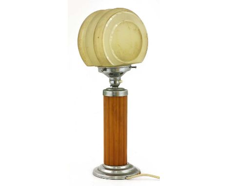 An Art Deco Bakelite lamp, with a reeded column below a moulded compressed spherical shade,42cm highCondition report: Loose o