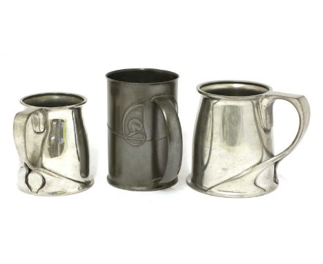 Three Tudric pewter tankards,designed by Archibald Knox, each stamped 'English Pewter' and numbered '066', '0334', the larges