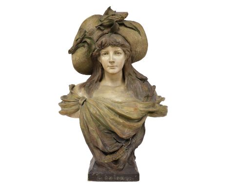 A painted terracotta bust 'L'Automne',attributed to Goldscheider, modelled as a bust of a lady, wearing a straw hat and robes