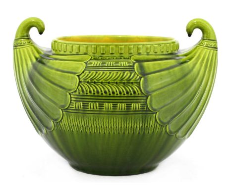 A Linthorpe Pottery jardinière,designed by Christopher Dresser (1834-1904) in the Egyptian style, moulded with scrolled handl