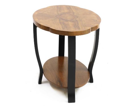 An Art Deco walnut and ebonised lamp table,with a quarter veneered shaped oval 'cloud' top with a crossbanded edge, over an o