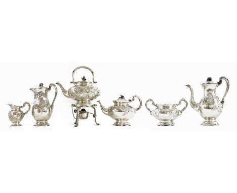 A rare Arts and Crafts silver seven-piece 'Country Range' tea and coffee service, and a twin-handle tray,maker's mark for Joh