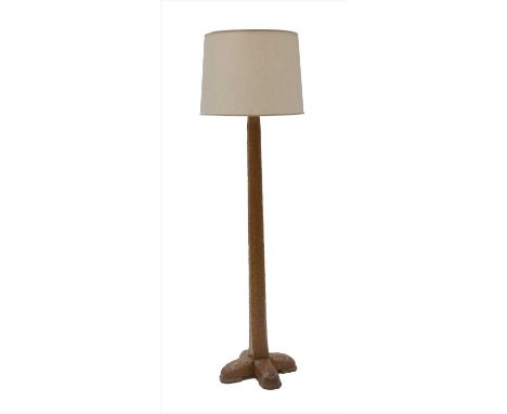 An oak standard lamp,dated 1957, designed by Stanley Webb Davies, with a cream shade,145cm high172cm overall