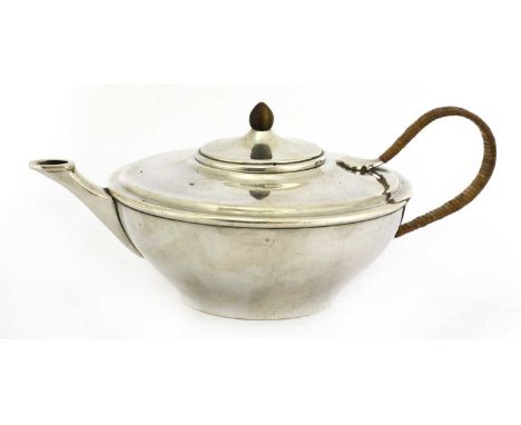 A silver teapot,maker's mark W A S Benson, London 1913,with a wicker handle and a turned knop,9.5cm high Condition report: ma