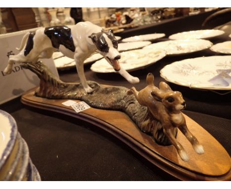 Ceramic greyhound and hare tableau on a wooden base unnamed