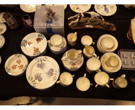 Two boxes of Poole tableware in the plum design dinner tea plates cups saucers etc 
