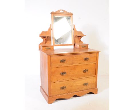 An early 20th century Edwardian satinwood dressing chest / table. The chest raised on bracket feet with a bank of three drawe