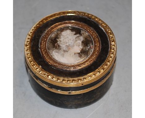 A late 19th century tortoiseshell and gold mounted circular pillbox and cover, with central bust portrait