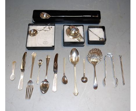 A silver caddy spoon; together with a silver christening spoon and other christening flatware