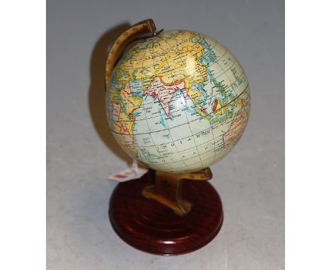 A 1950s Chad Valley tinplate desktop globe