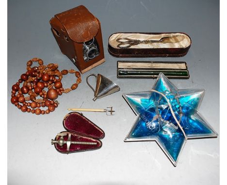 Mixed lot, to include wooden ethnic beaded necklaces, Irish silver plated wine funnel, leather cased mid-20th century Ilford 