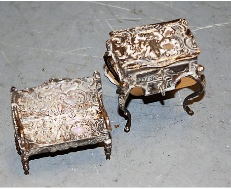 An early 20th century German silver pillbox, in the form of a dressing table, with hinged cover, by Simon Rosenau; and a mini