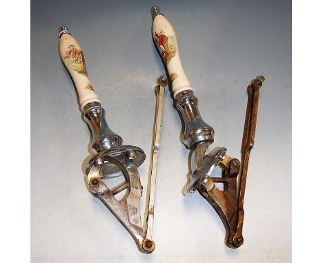 A pair of chrome beer pumps, each ceramic handle depicting a hunting scene