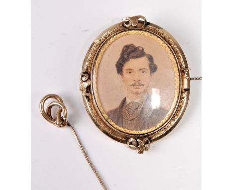 A hairwork portrait miniature brooch, the oval brooch with a watercolour of a gentleman to one side and hairwork to the other