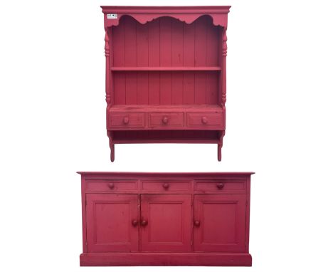Pink painted pine sideboard, rectangular top with moulded edge over three frieze drawers and three panelled cupboards, on pli