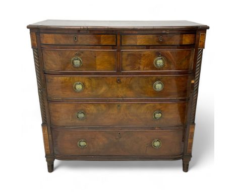 Early 19th century inlaid mahogany bow-front chest, fitted with two secret drawers, above two short and three long drawers fl