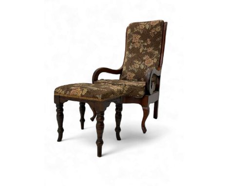 Early 20th century mahogany open armchair, upholstered in pink floral fabric on a brown ground, high back and scrolled arms, 