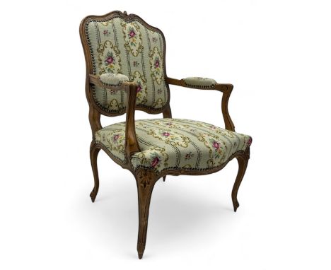 French design beech framed fauteuil open armchair, upholstered in floral pattern needlework cover, on shell carved cabriole s