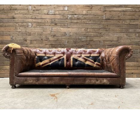 Chesterfield two sofa upholstered in brown leather, with Union Jack pattern, no seat cushions - located in storage, viewing n