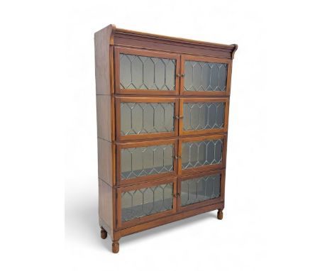 Early 20th century Globe Wernicke design stacking walnut bookcase, fitted with four sections each with two leaded glass doors