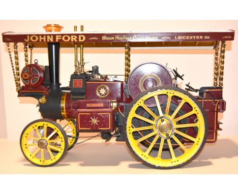 A well built model of a Showman's Traction engine, 2inch scale with wooden canopy, built by John Ford of Leicester painted in