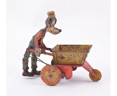 Louis Marx toys, tin-plate Goofy the Gardener, made c1948, 24cm.