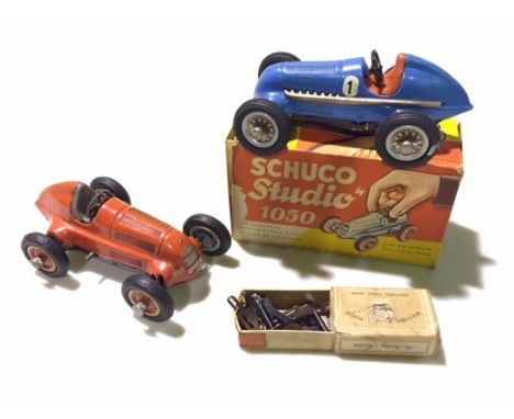 Schuco tin-plate toy 1050 racing cars, one boxed with tools, other is loose and a Mamod stationary engine.
