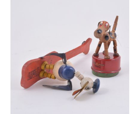Tri-ang Wakouwa toy dog, and a Donald Duck pull string puppet toy.