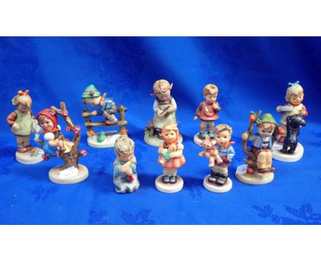 A COLLECTION OF GOEBEL FIGURES with childhood themes