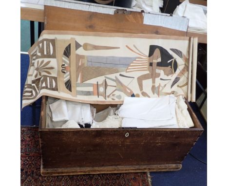 A QUANTITY OF TEXTILES IN A VICTORIAN PINE TRUNK including two Egyptian applique wall hangings, pillow cases, tablecloths and