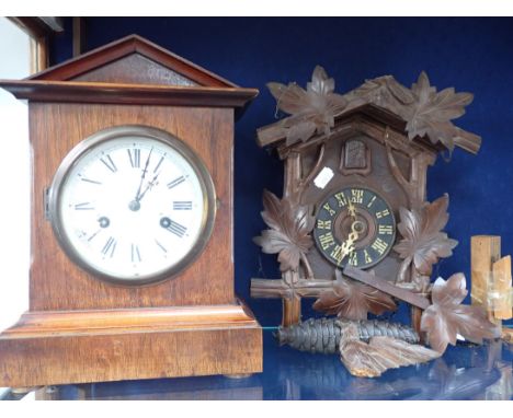 A VICTORIAN MAHOGANY CASED MANTEL CLOCK with plain pedimented case, enamel dial, striking on a gong (old woodworm), and a Bla
