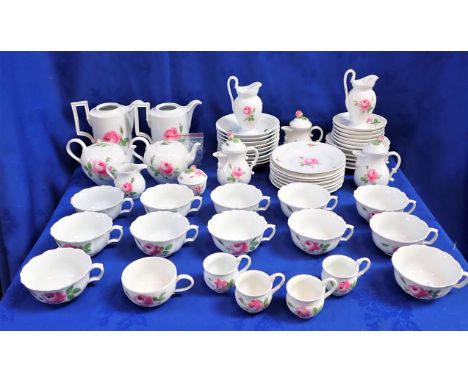 A 20TH CENTURY MEISSEN TEA SERVICE (some chips) (all cups, saucers and both coffee pots have two strikes through the marks)